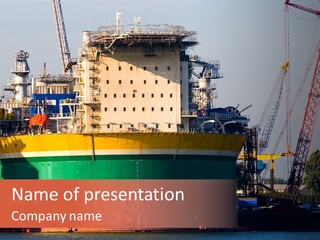 A Large Green And Yellow Boat In A Body Of Water PowerPoint Template