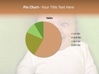 A Smiling Baby Laying On A Green Blanket PowerPoint Template