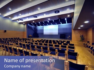 A Lecture Hall With Rows Of Chairs And A Projector Screen PowerPoint Template