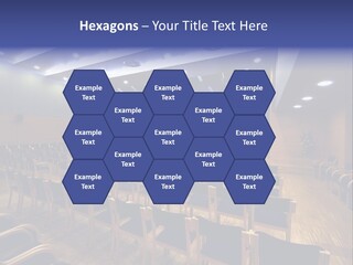 A Lecture Hall With Rows Of Chairs And A Projector Screen PowerPoint Template