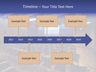 A Lecture Hall With Rows Of Chairs And A Projector Screen PowerPoint Template