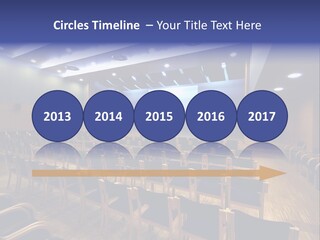 A Lecture Hall With Rows Of Chairs And A Projector Screen PowerPoint Template