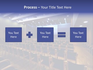 A Lecture Hall With Rows Of Chairs And A Projector Screen PowerPoint Template
