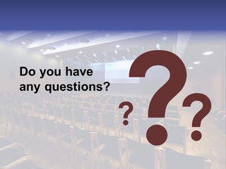 A Lecture Hall With Rows Of Chairs And A Projector Screen PowerPoint Template