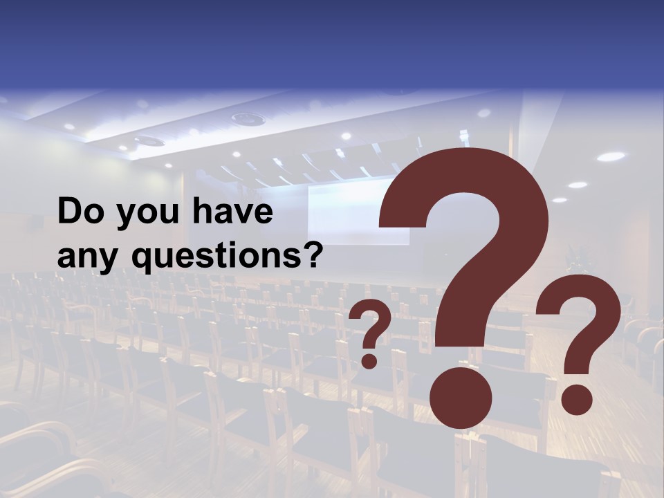 A Lecture Hall With Rows Of Chairs And A Projector Screen PowerPoint Template