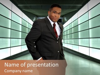 A Man In A Suit Is Standing In A Room PowerPoint Template