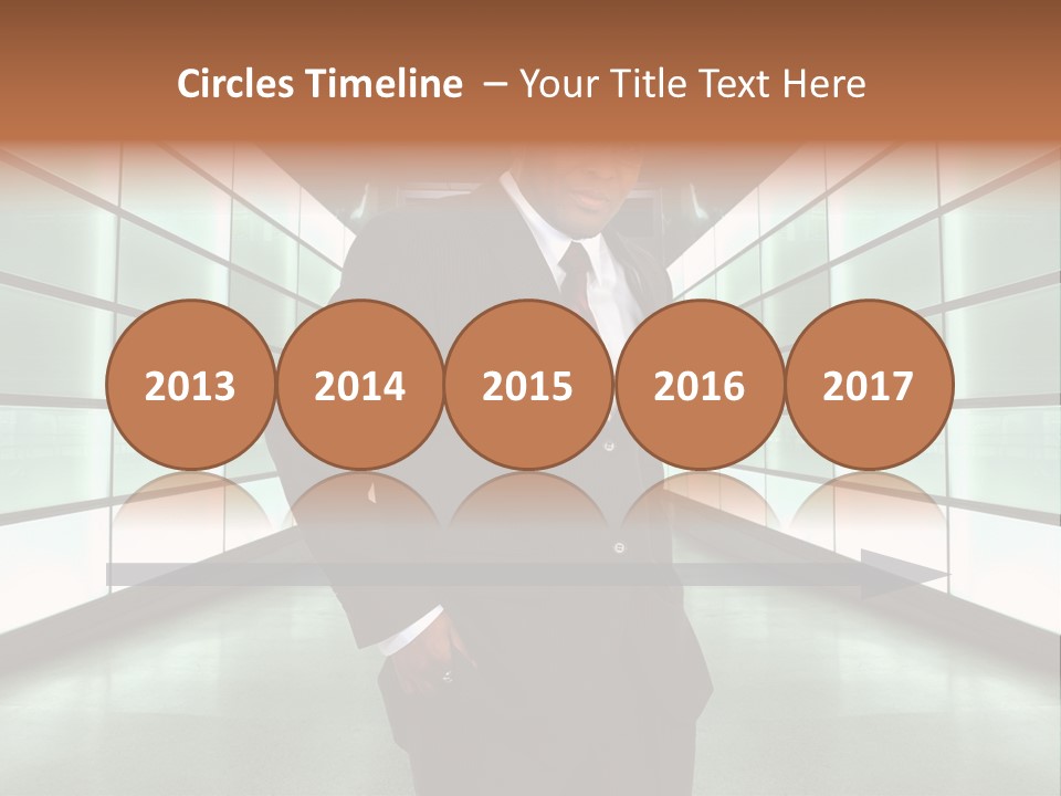 A Man In A Suit Is Standing In A Room PowerPoint Template