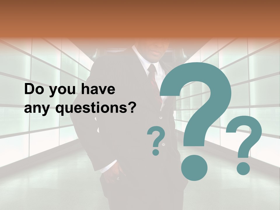 A Man In A Suit Is Standing In A Room PowerPoint Template