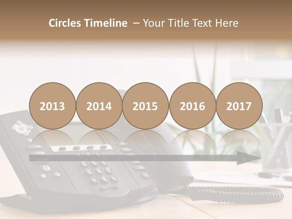 A Phone Sitting On Top Of A Wooden Desk PowerPoint Template