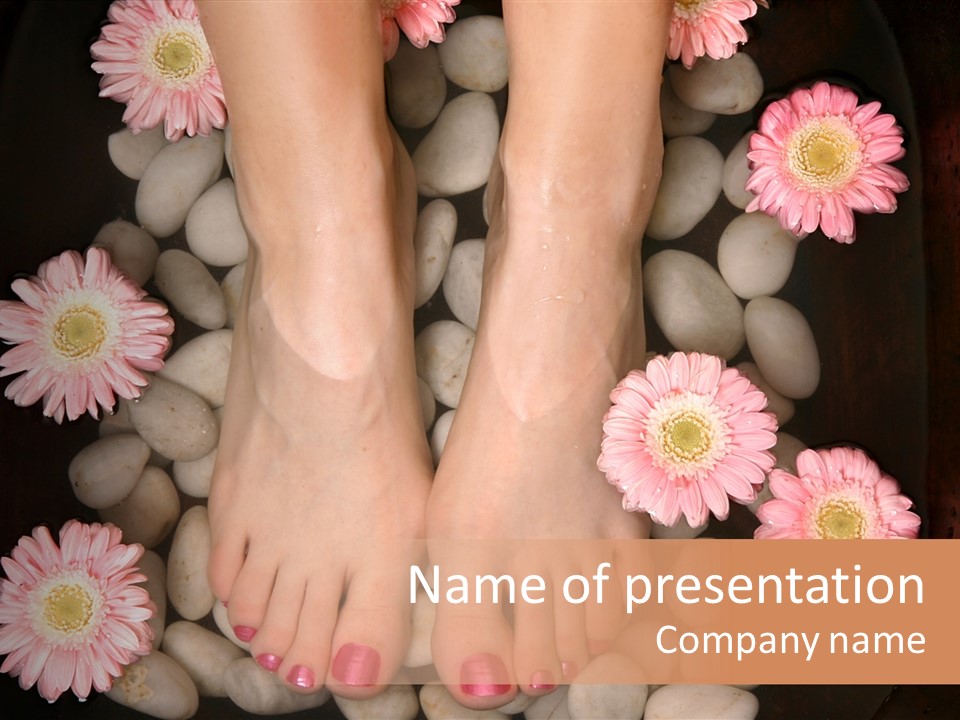 A Woman's Feet In A Bowl Of Rocks With Pink Flowers PowerPoint Template