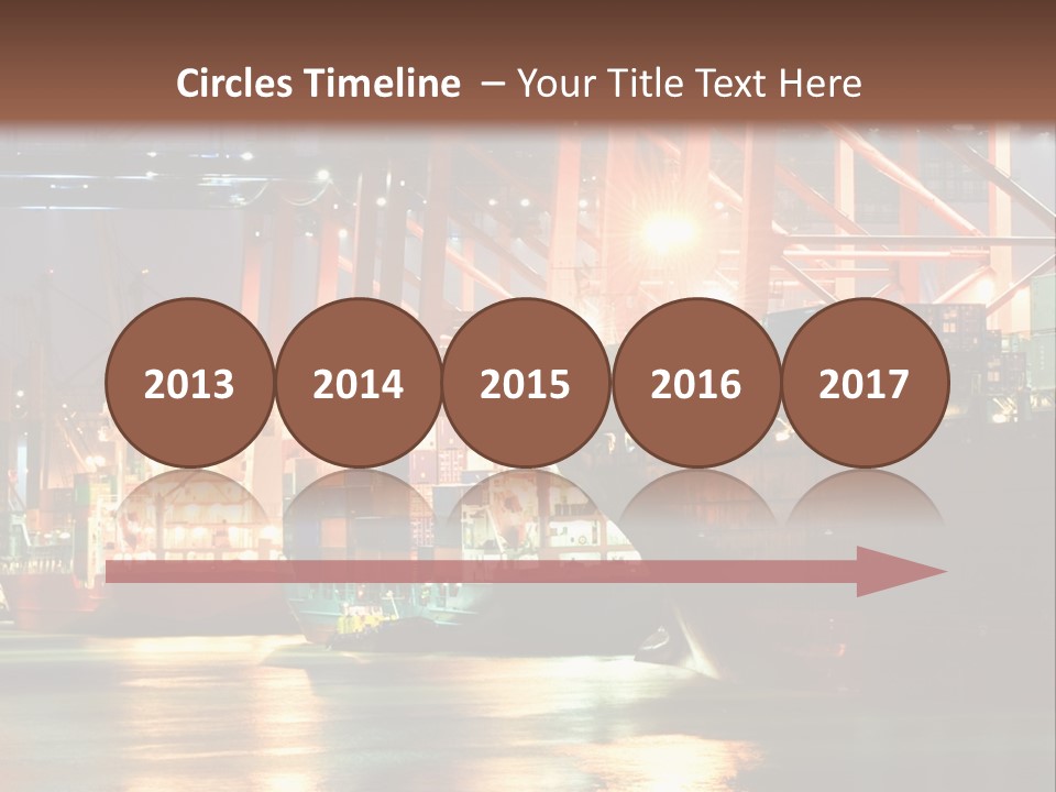 A Large Cargo Ship In A Harbor At Night PowerPoint Template