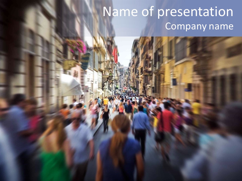 A Large Group Of People Walking Down A Street PowerPoint Template