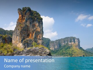 A Large Body Of Water With Mountains In The Background PowerPoint Template