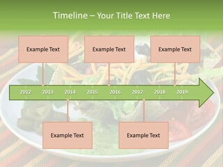 A White Plate Topped With A Salad Covered In Cheese PowerPoint Template
