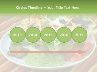 A White Plate Topped With A Salad Covered In Cheese PowerPoint Template