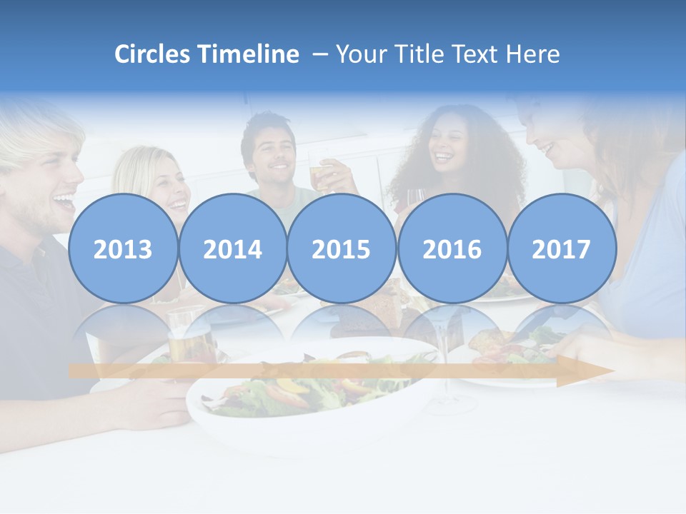 A Group Of People Sitting Around A Table Eating Food PowerPoint Template