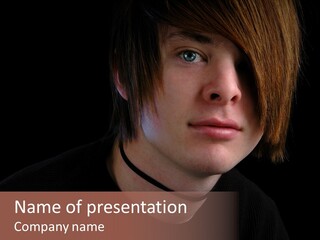 A Young Man With Brown Hair And A Black Shirt Is Looking At The Camera PowerPoint Template