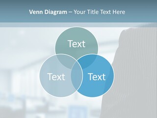 A Man In A Suit And Tie Standing In A Room PowerPoint Template