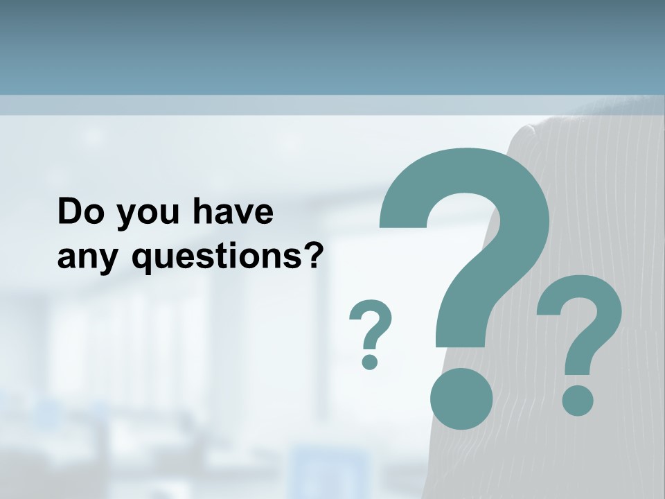 A Man In A Suit And Tie Standing In A Room PowerPoint Template