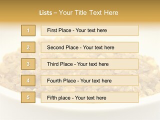 A White Bowl Filled With Cereal On Top Of A Table PowerPoint Template