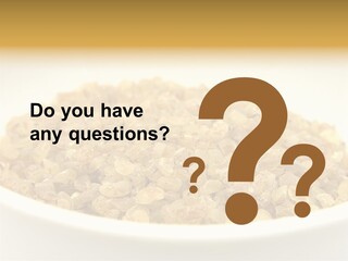A White Bowl Filled With Cereal On Top Of A Table PowerPoint Template