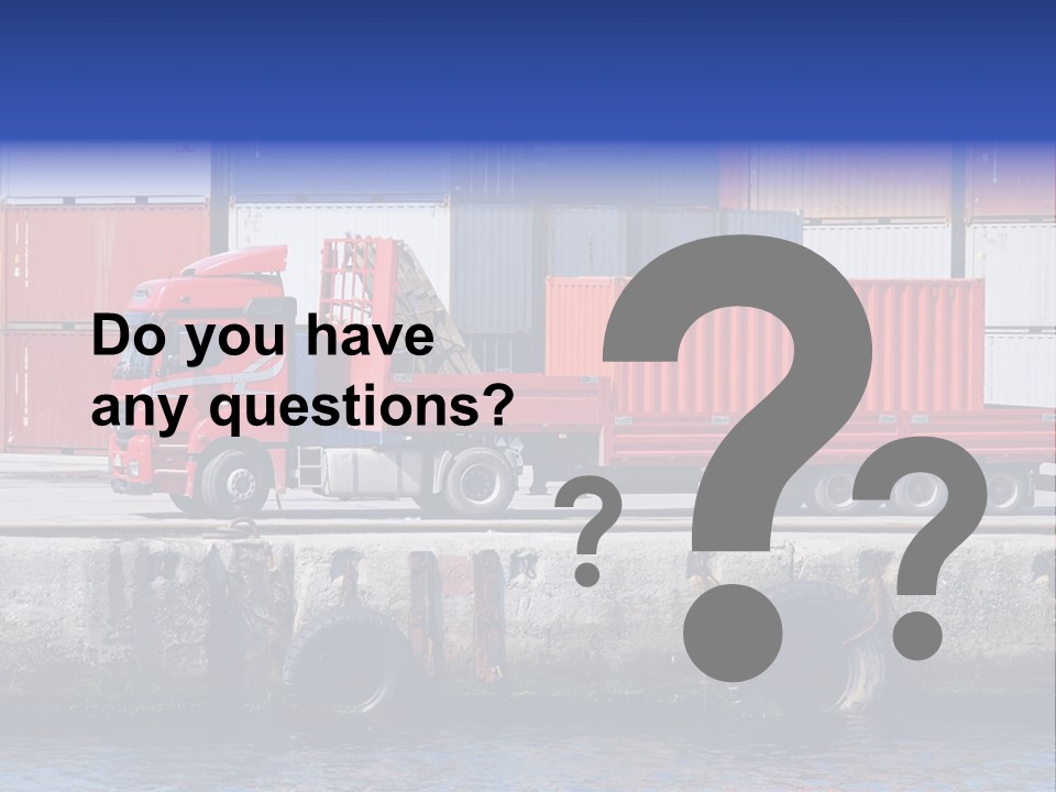 A Red Truck Is Parked Next To A Body Of Water PowerPoint Template