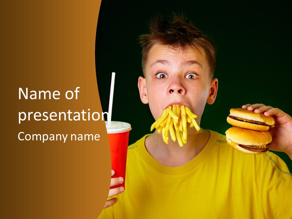A Young Boy Is Eating A Hamburger And Fries PowerPoint Template