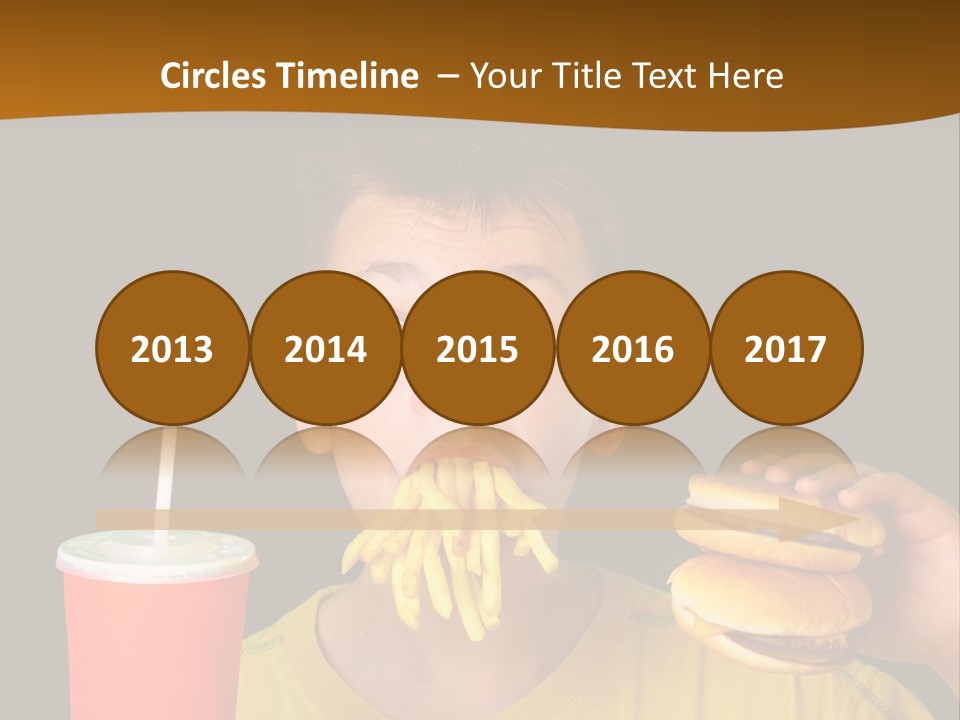 A Young Boy Is Eating A Hamburger And Fries PowerPoint Template