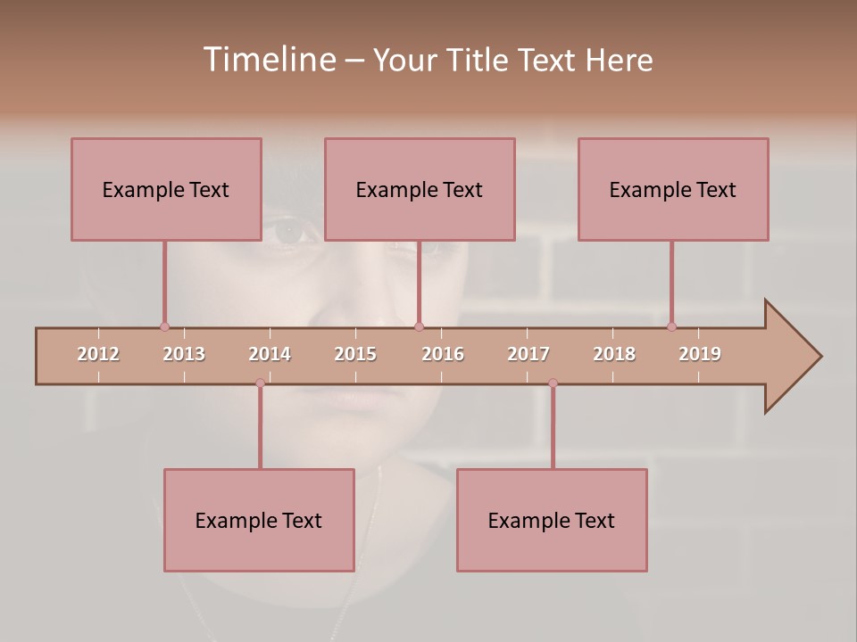A Young Boy Is Looking At The Camera With A Brick Wall Behind Him PowerPoint Template
