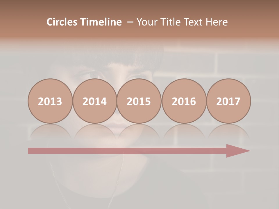 A Young Boy Is Looking At The Camera With A Brick Wall Behind Him PowerPoint Template