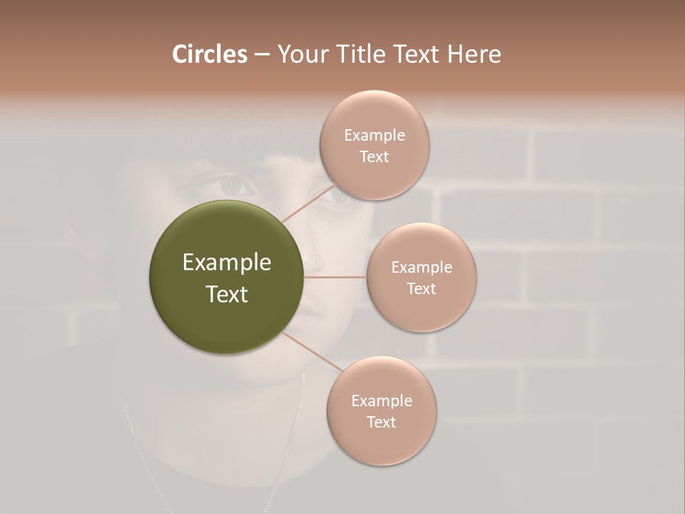 A Young Boy Is Looking At The Camera With A Brick Wall Behind Him PowerPoint Template