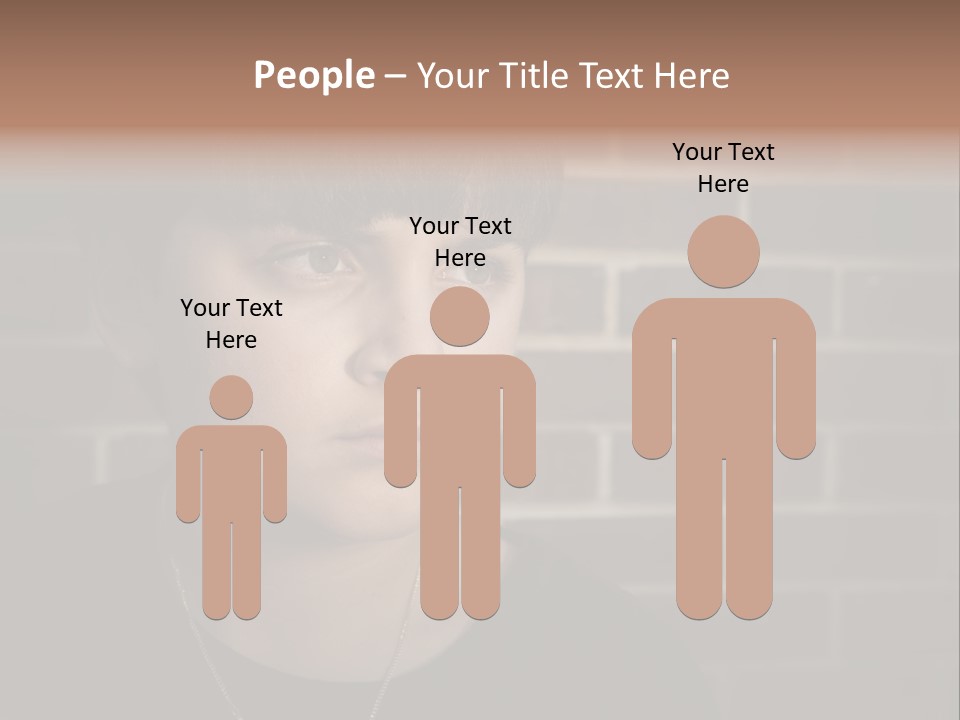 A Young Boy Is Looking At The Camera With A Brick Wall Behind Him PowerPoint Template