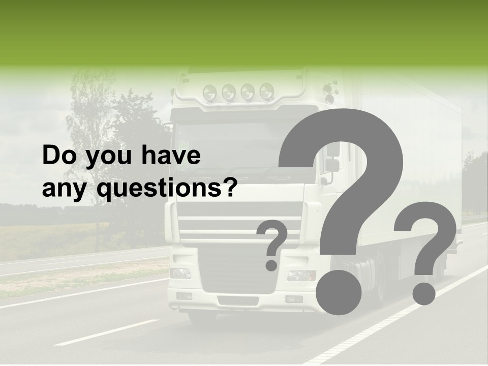 A Large White Truck Driving Down A Road PowerPoint Template