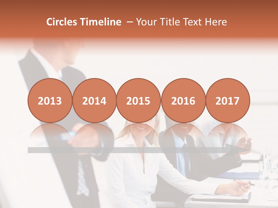 A Group Of Business People Sitting At A Table PowerPoint Template