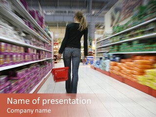 A Woman Is Walking Down The Aisle Of A Grocery Store PowerPoint Template