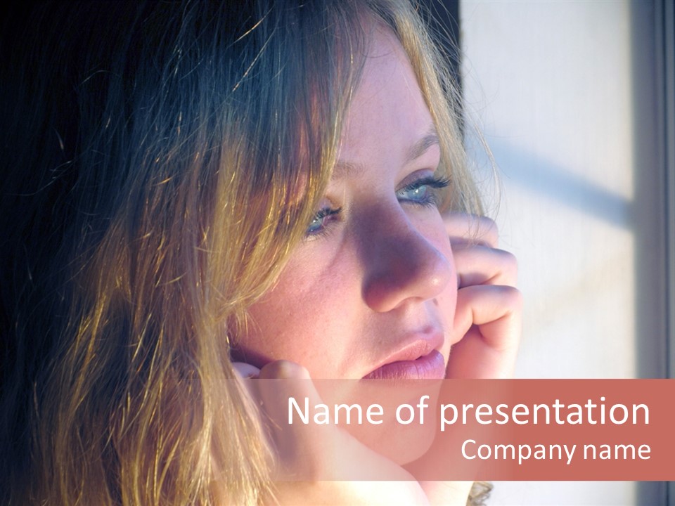 A Woman Looking Out Of A Window With Her Hand On Her Face PowerPoint Template