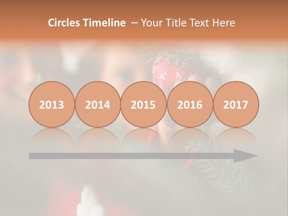 A Child Holding A Christmas Ornament In Front Of A Christmas Tree PowerPoint Template