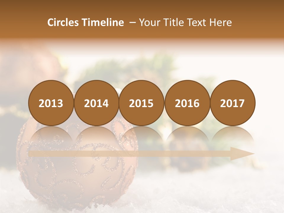 A Christmas Ornament Sitting In The Snow PowerPoint Template