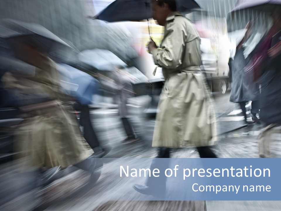 A Group Of People Walking Down A Street Holding Umbrellas PowerPoint Template