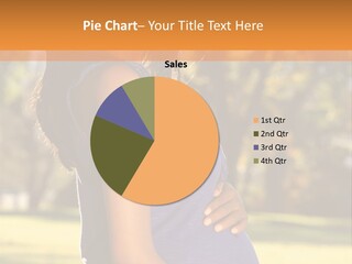 A Pregnant Woman In A Blue Dress Is Smiling PowerPoint Template