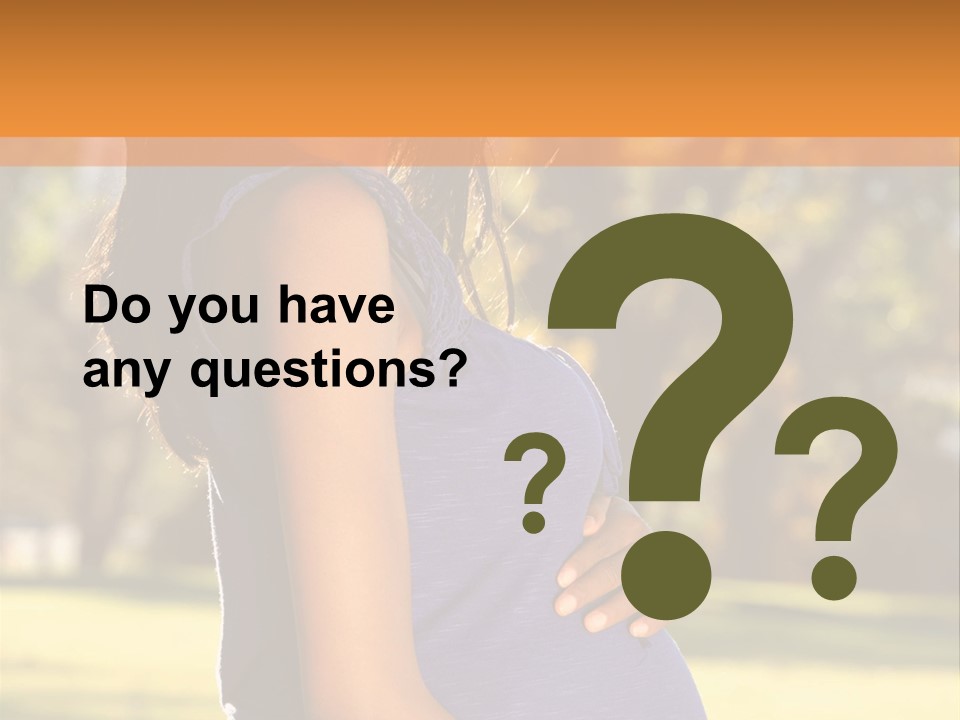 A Pregnant Woman In A Blue Dress Is Smiling PowerPoint Template