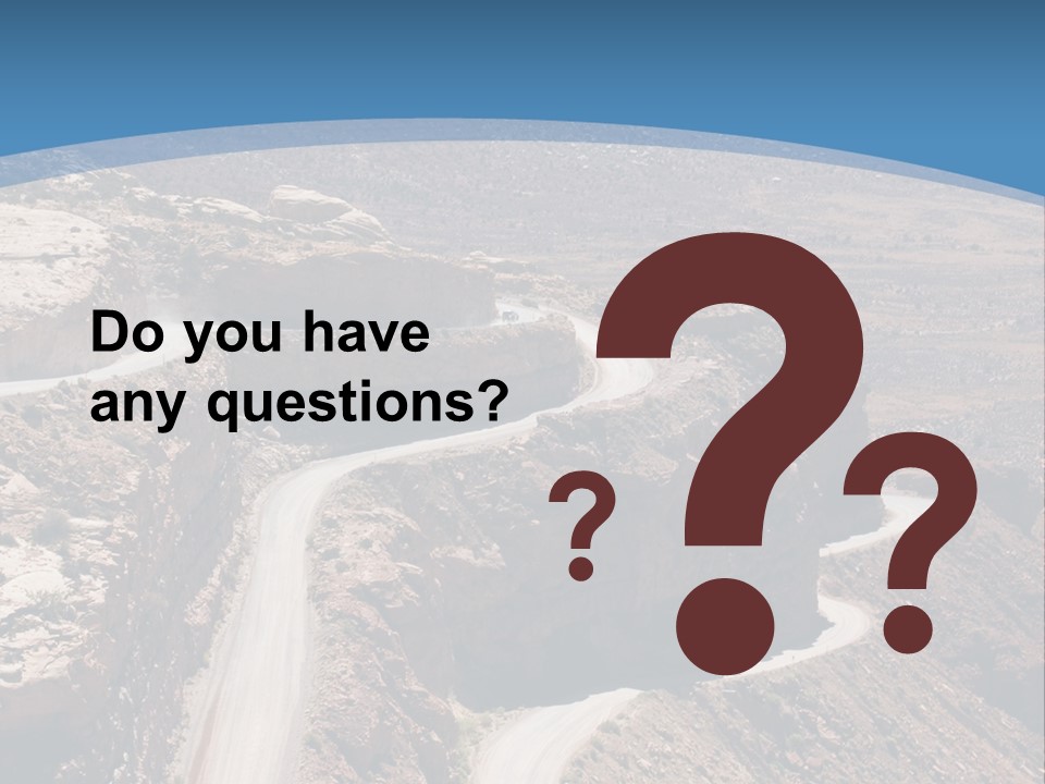 A Scenic View Of A Canyon With A Road Going Through It PowerPoint Template