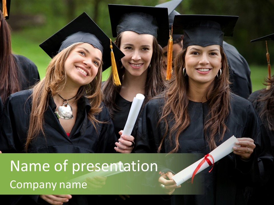 A Group Of Women In Graduation Gowns Holding Diplomas PowerPoint Template