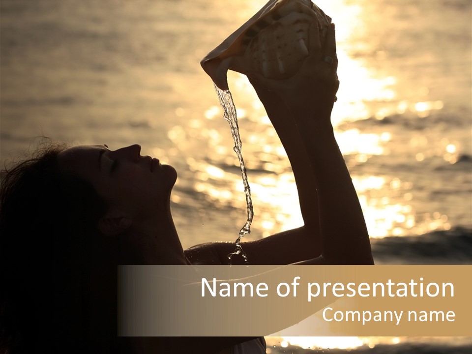 A Woman Holding Up A Shell In Front Of The Ocean PowerPoint Template