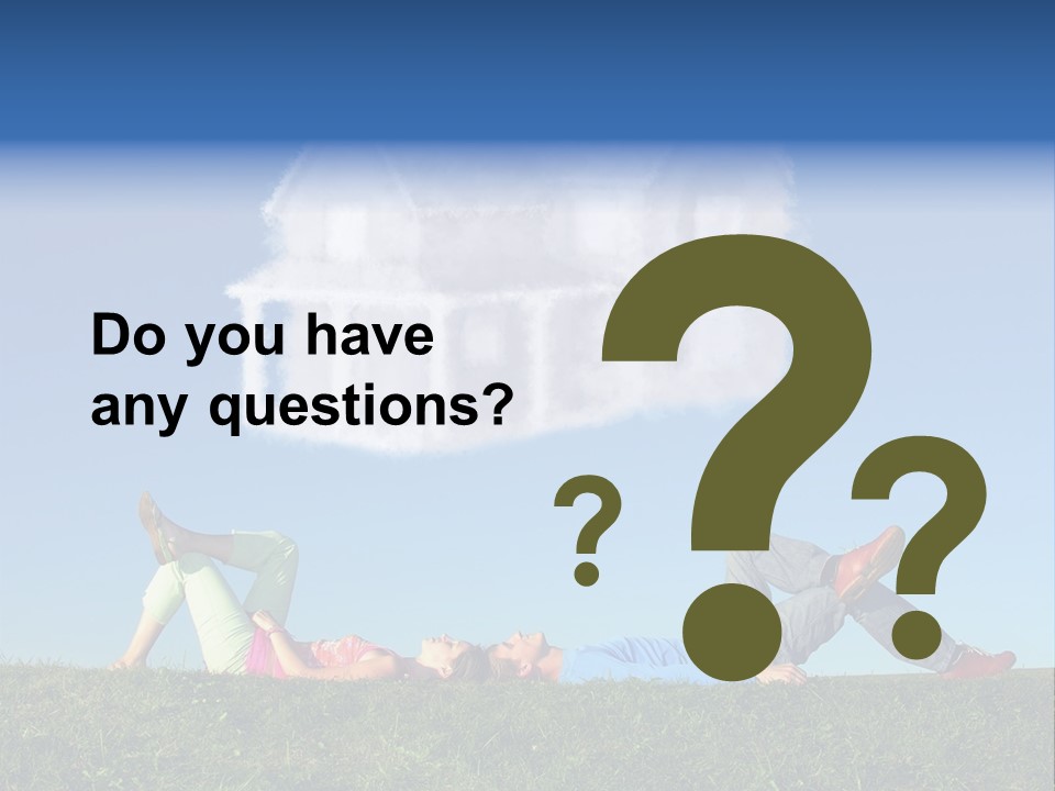 A Man And A Woman Laying On The Grass In Front Of A House PowerPoint Template