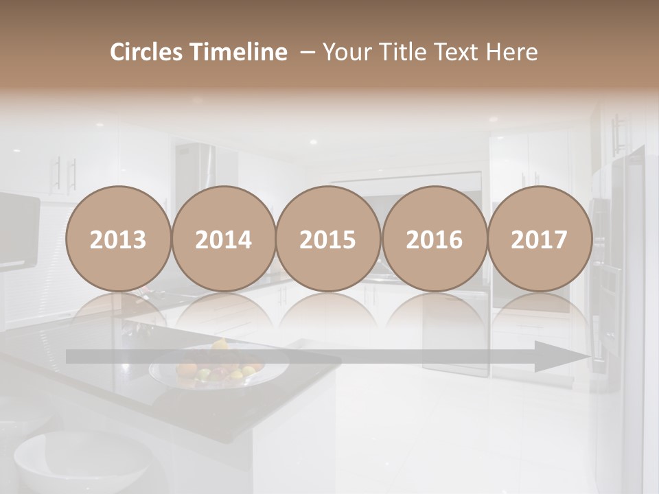 A Kitchen With A Black Counter Top And White Cabinets PowerPoint Template