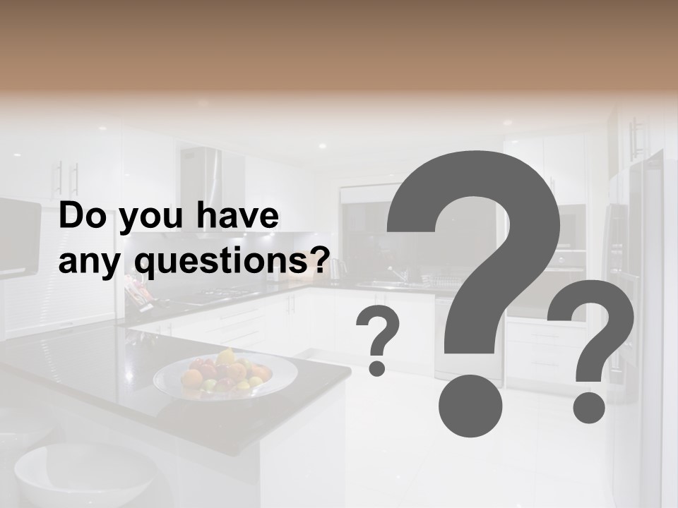 A Kitchen With A Black Counter Top And White Cabinets PowerPoint Template