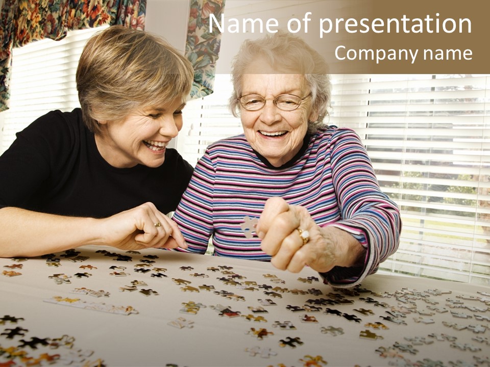An Elderly Woman And A Young Woman Playing With A Puzzle PowerPoint Template