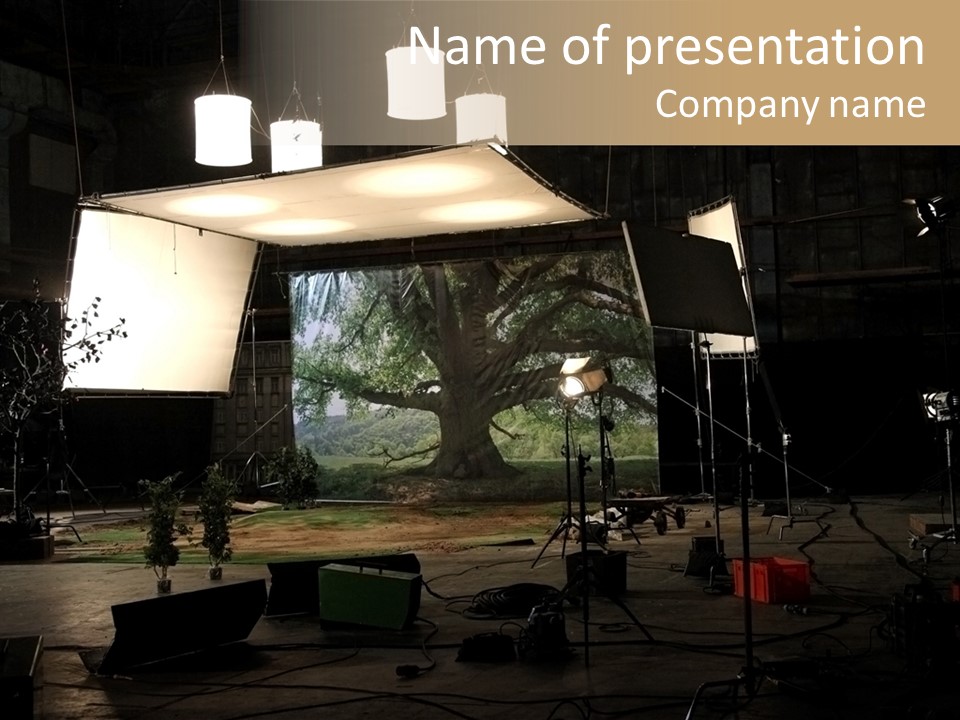 A Photo Studio With A Large Screen And Lighting Equipment PowerPoint Template
