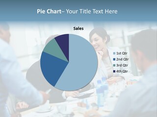 A Group Of Business People Sitting Around A Table PowerPoint Template